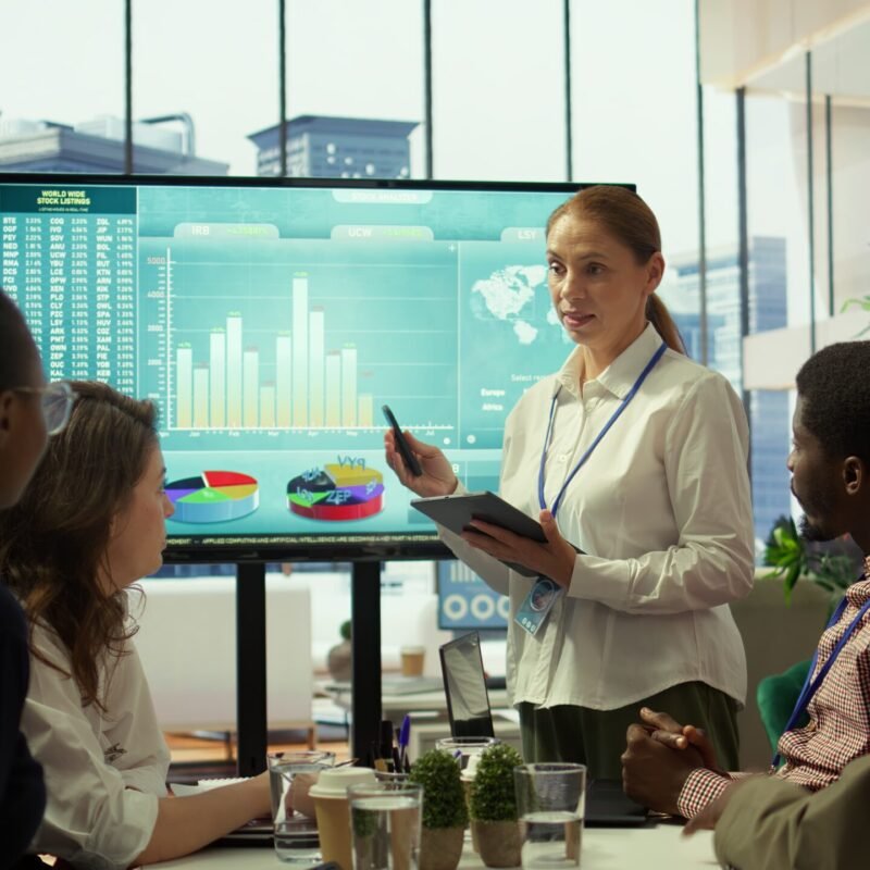 group-business-associates-discussing-project-development-plans-min